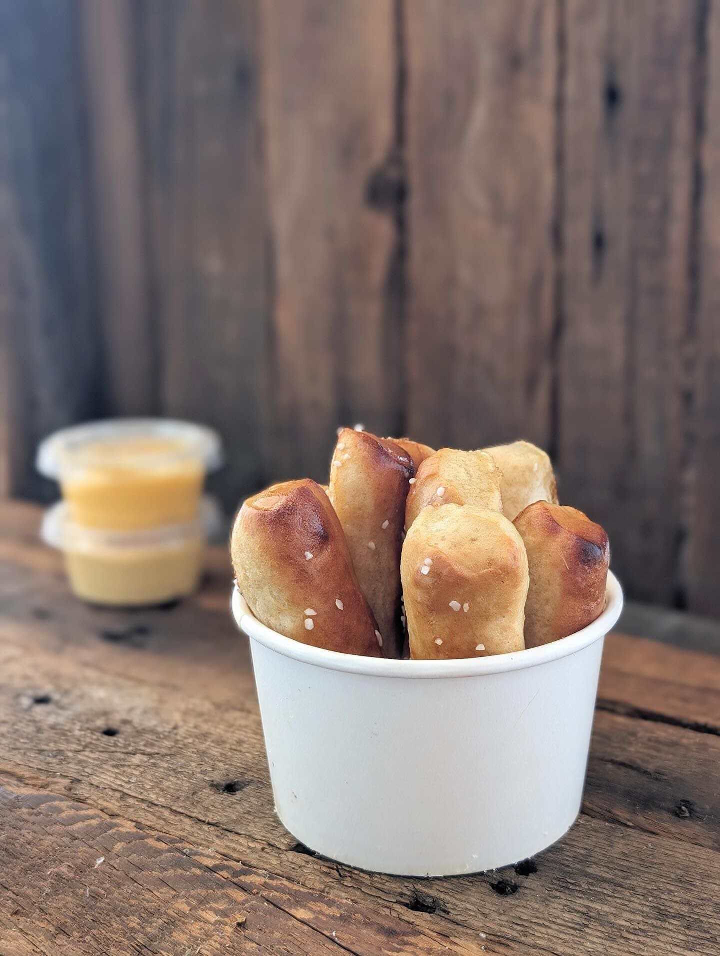 Pretzel sticks with cheese cups.